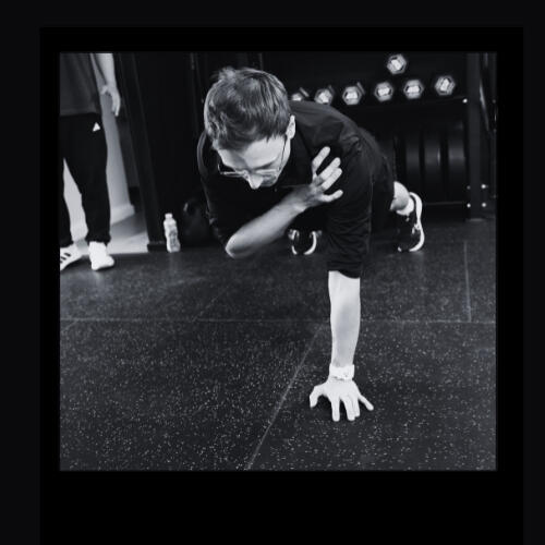 Damien holding weights Damien celebrating weight loss at teknique